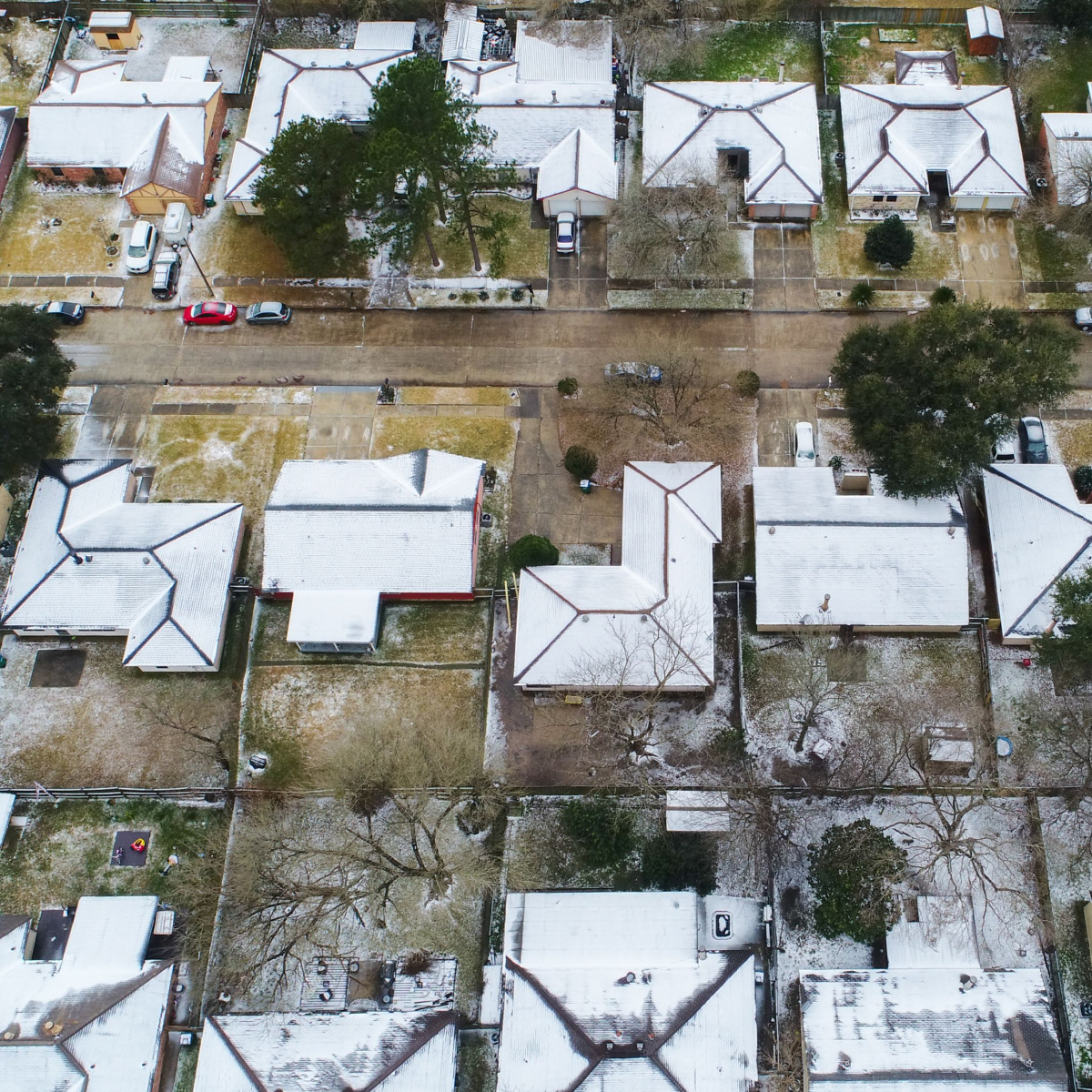 A bird's eye view of homes that could have some Dallas winter roof damage and in need of winter storm roof repair